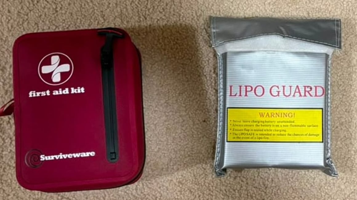 The LiPo guard charging bag and the first aid kit from the field safety kit, laid out