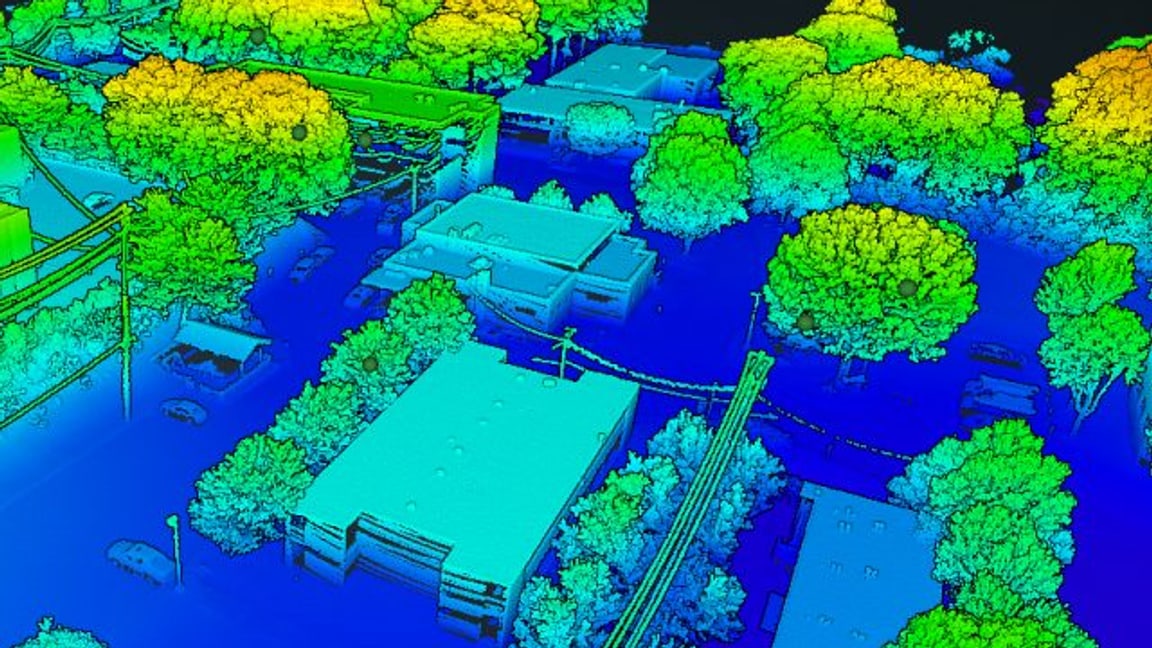 Close detail of the survey map: individual buildings, parked vehicles, power lines and tree canopy resolved and coloured by height