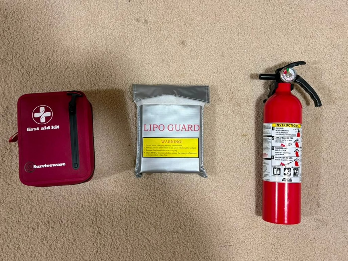 V-TECH field safety kit: fire extinguisher, LiPo charging guard bag, and first aid kit